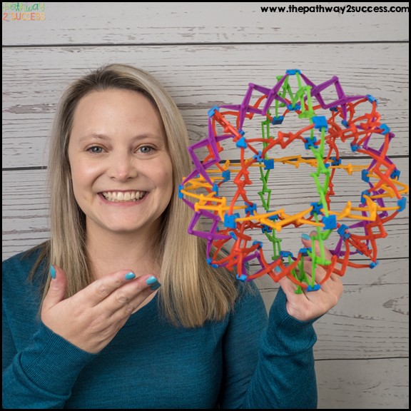 Kris from Pathway 2 Success holding a mindfulness breathing ball (also called a Hoberman sphere)
