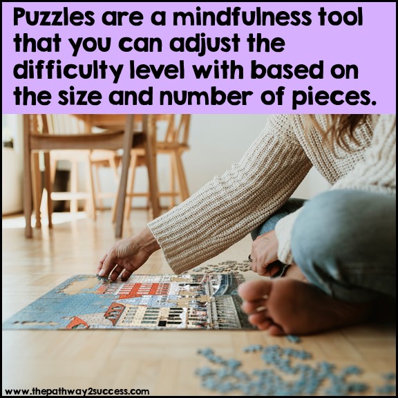A person mindfully completing a puzzle on the floor