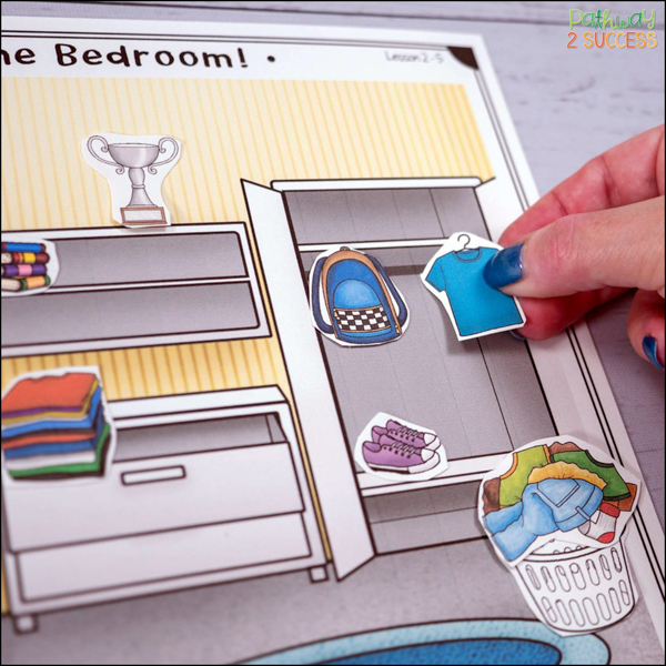 Printed organization activity with person moving items into the correct space in each room
