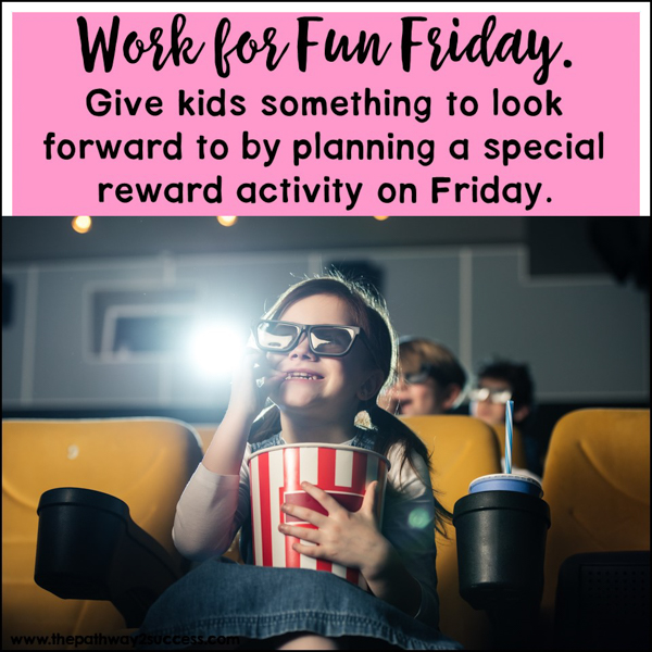Young student enjoying "Fun Friday" by watching a movie and eating popcorn